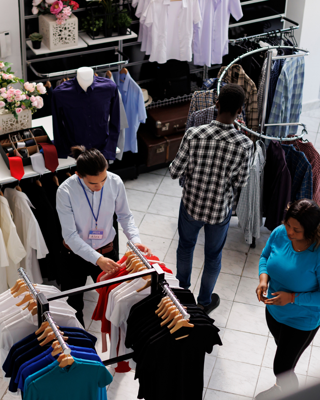 London red buses lined up on the road with adverts on their side.